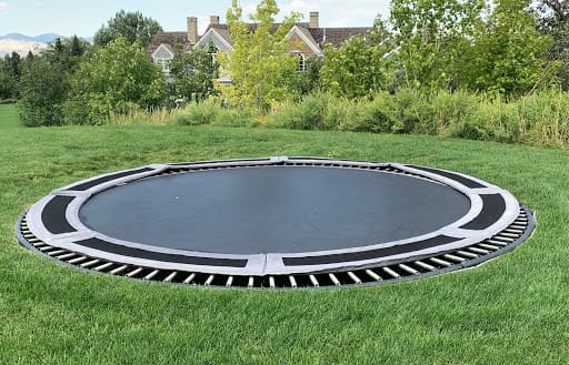 No luxury estate garden tour is complete without a built-in, ground-level trampoline.