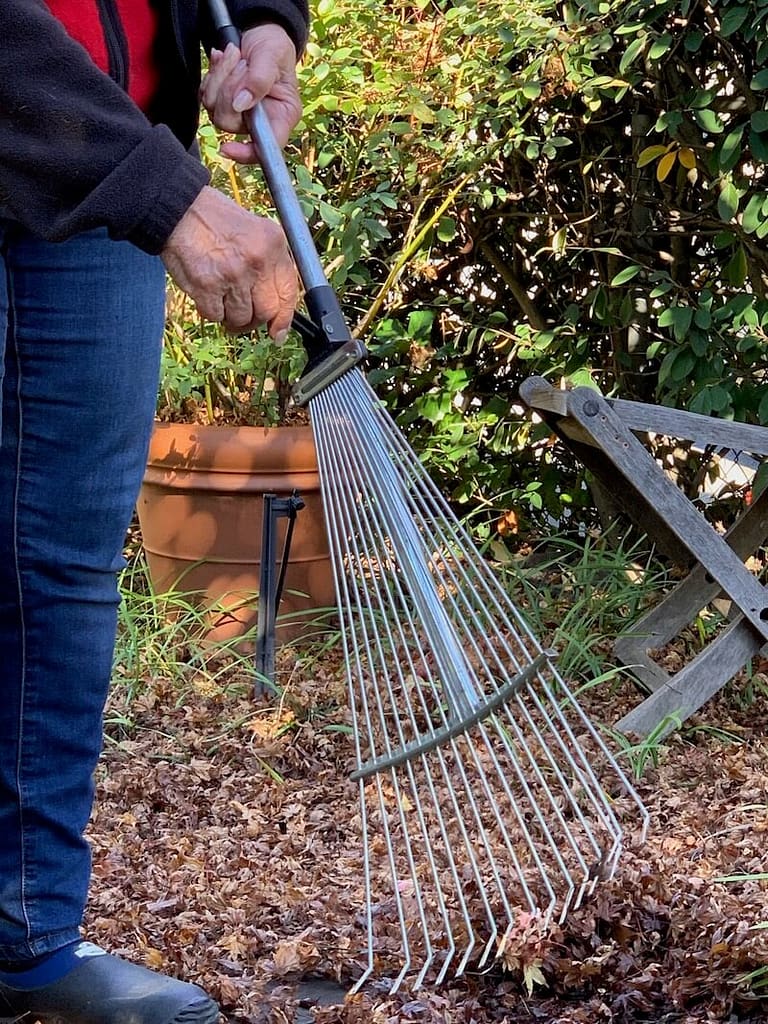 Toni Gattone holds the Tabor Tools Collapsible and Expandable Rake