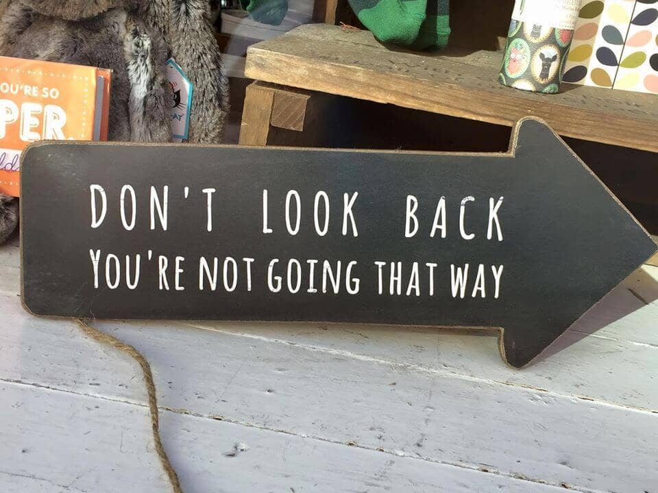 Don't look back, you're not going that way sign