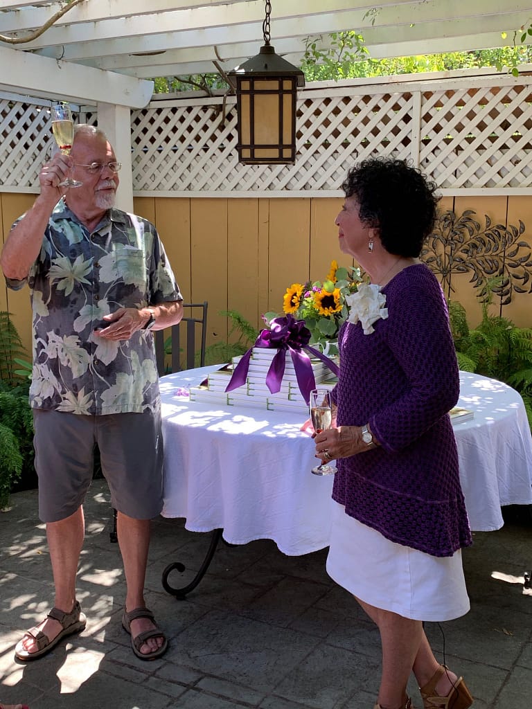 Tim King, Toni Gattone's husband, toasting his wife's success in launching her new book, The Lifelong Gardener.